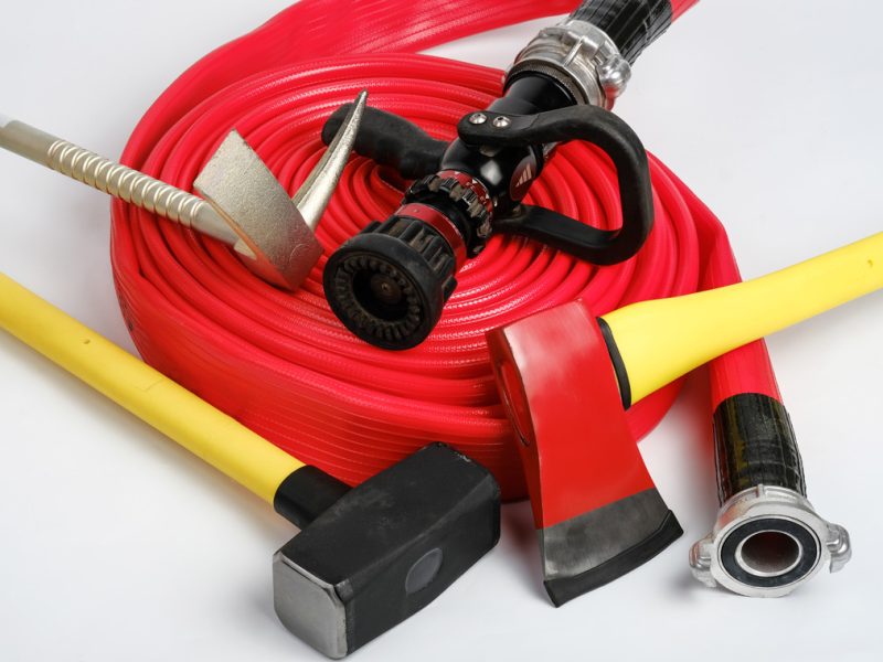 large-yellow-sledgehammer-axe-hooligan-pinch-bar-rolled-fire-hose-from-fireman-s-toolbox-white-background_small
